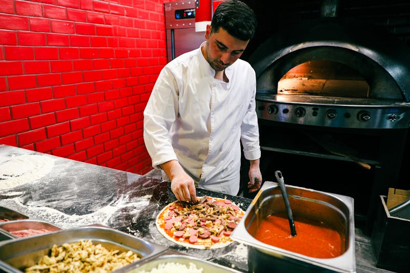 Via 313 team preparing pizza in the kitchen